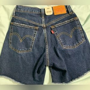 New with tags. Never worn, high rise mid thigh  Levi 501 women’s shorts size 24.